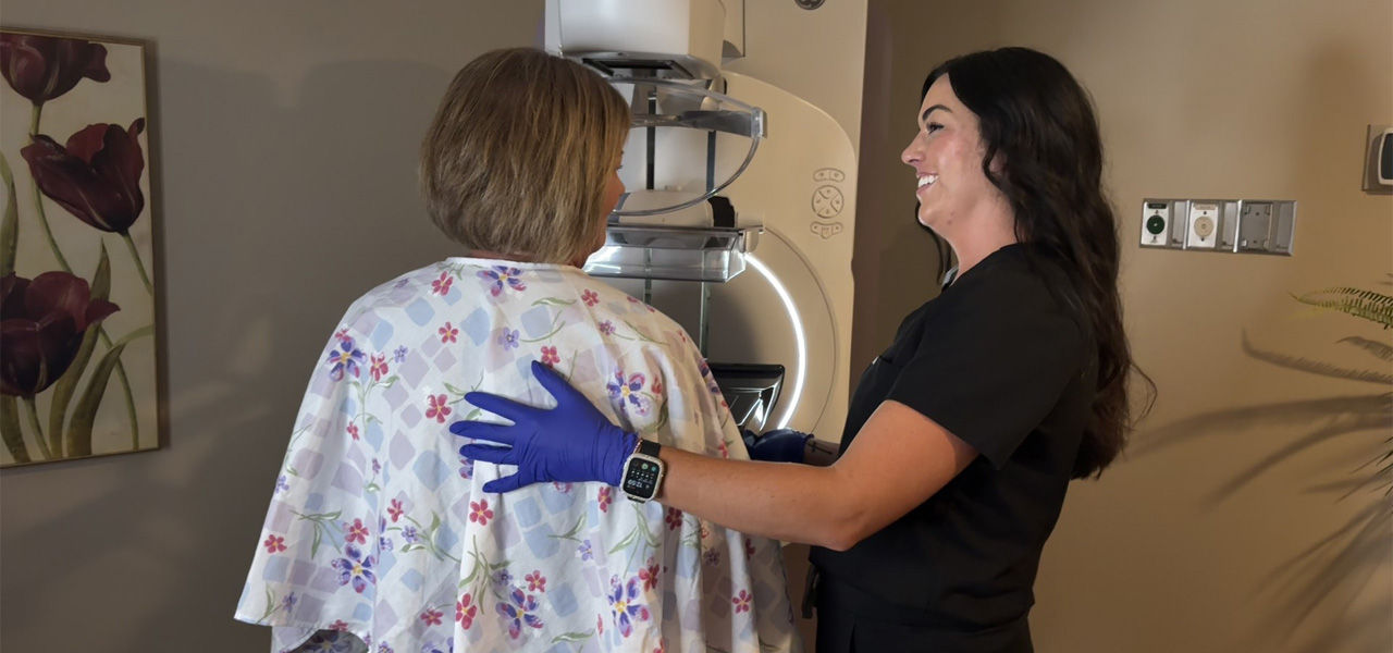 mammography specialist works with patient to get 3D mammogram at SageWest Lander