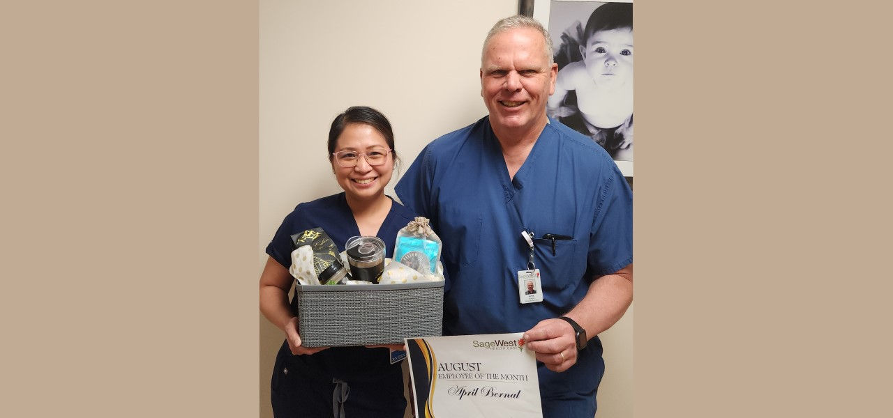 April Bernal receiving employee of the month certificate