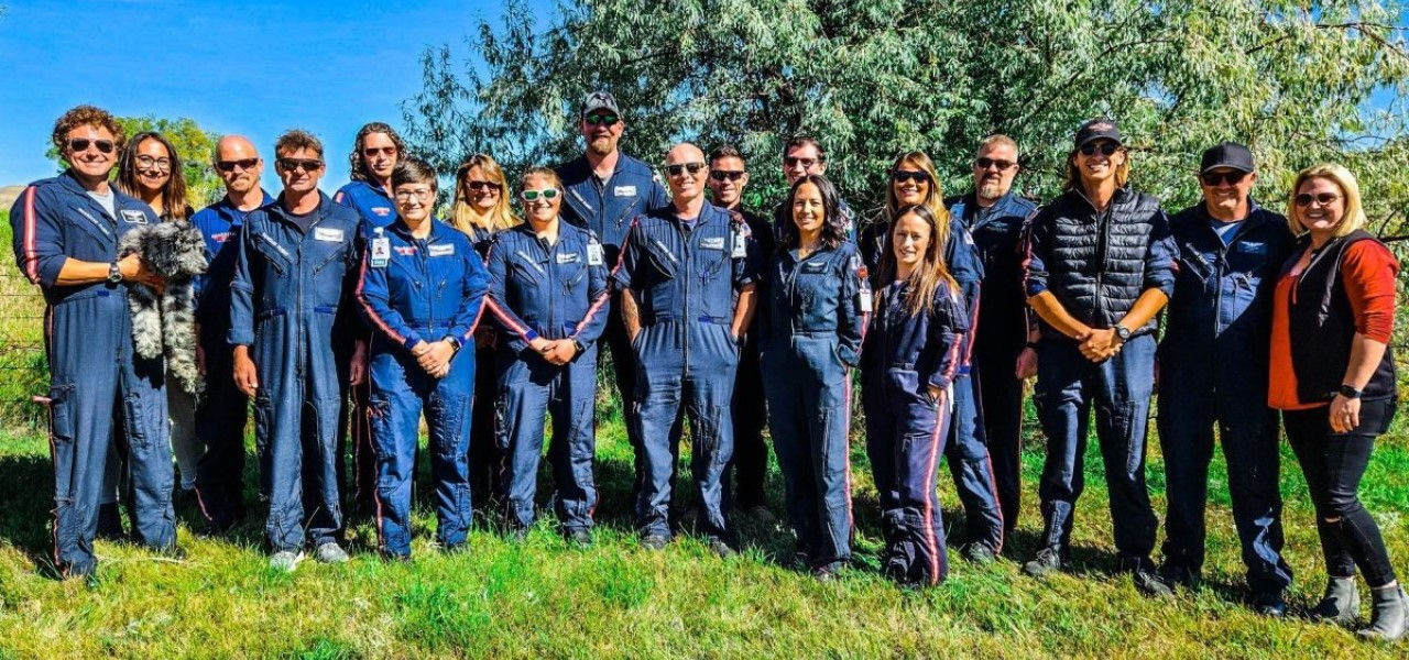 EMS workers in front of a tree